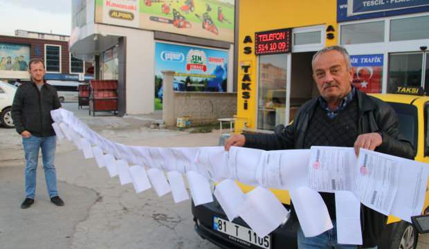 Yediği trafik cezaları 6 metreyi buldu